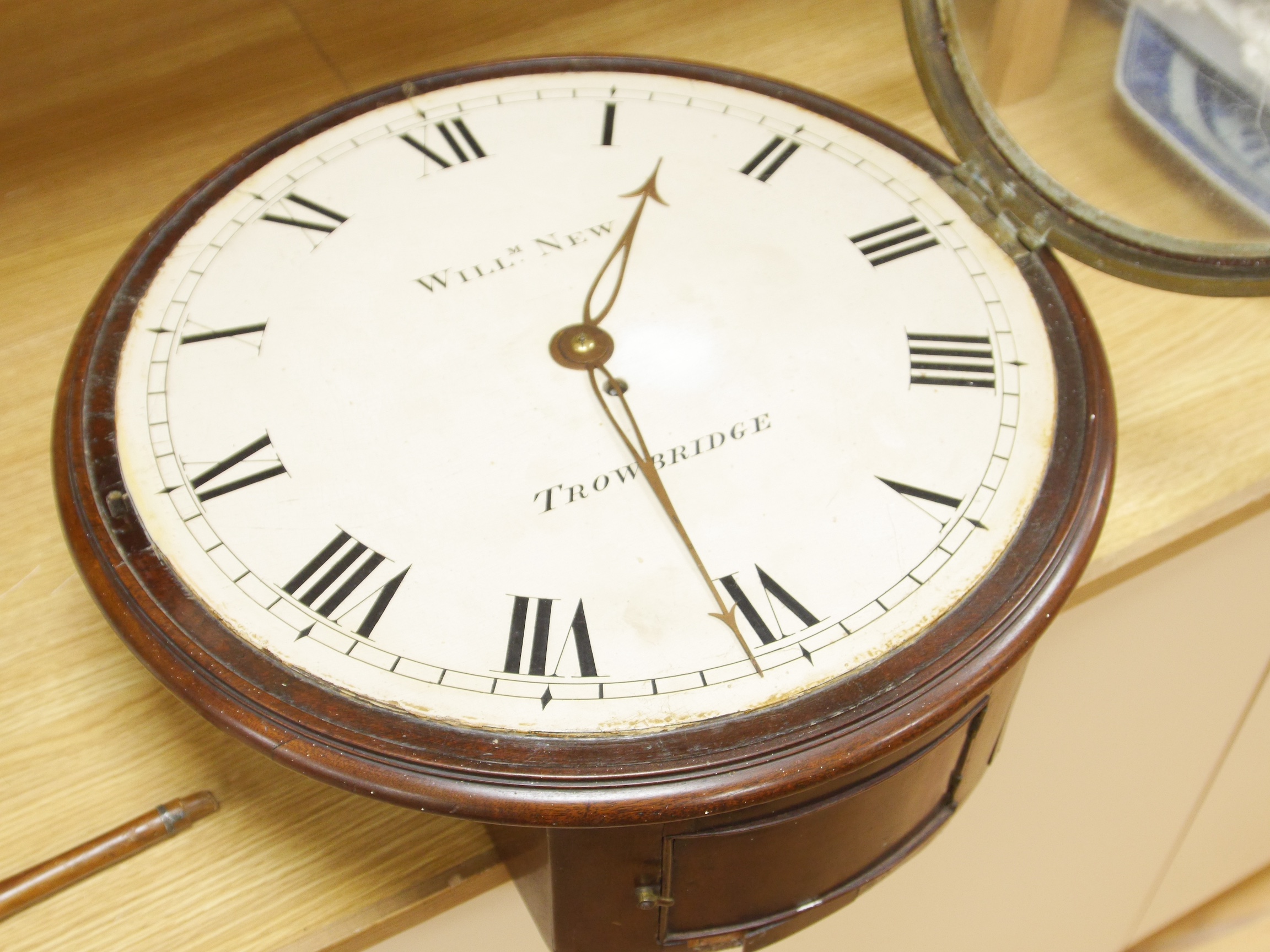 A large mahogany wall clock, William New, Trowbridge, with Roman numeral dial, associated single fusee movement with verge escapement, 49cm in diameter. Condition - fair to good, not tested